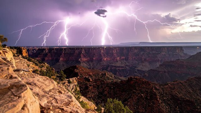 Dramatic Lightning Strike Over Canyon During Stormy Weather.
