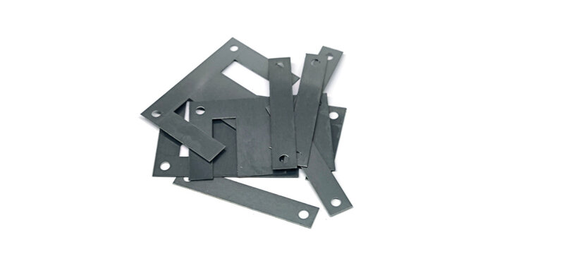 Ferrite core for transformers on a white background.