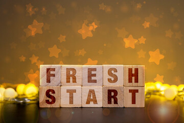 Fresh Start Message on Wooden Blocks for Personal Resolution Planning and Career Change Motivation