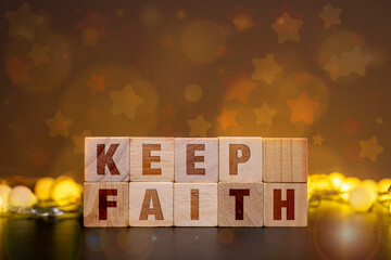 Fototapeta premium Keep Faith Inspirational Message on Wooden Blocks with Warm Bokeh Lights Background