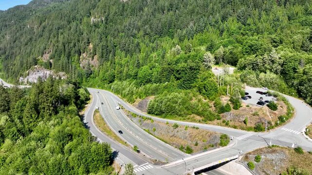 Orbital Drone Shot Over Sea to Sky Highway Interchange in Coastal Forest, British Columbia Canada
