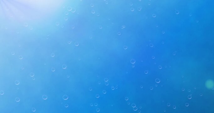 Underwater background. Moving banner with bubbles rising toward sun rays in blue water of sea or ocean. Empty space for text. Realistic graphic animated cartoon