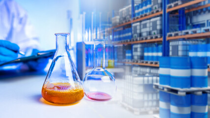 Chemical industry, Laboratory analysis. Glass flasks with colored solutions on workbench in...