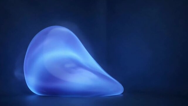 Enigmatic Glowing Orb: A mesmerizing, luminous object pulses with an ethereal blue light, casting a subtle glow against a dark backdrop. The smooth, organic shape hints at hidden energy and mystery.
