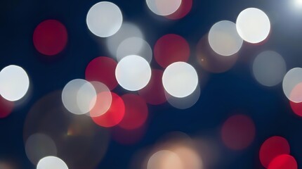 Fototapeta premium Festive bokeh lights background with red and white circular blur effects creating magical holiday atmosphere for celebrations and decorative designs.