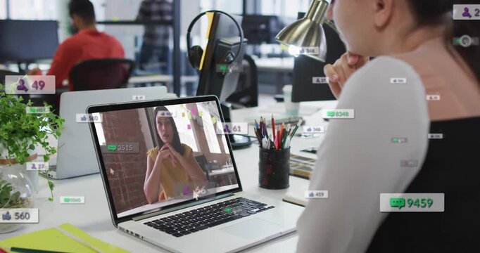Female viewer watching laptop live feed, overlays responding with rising social counts for business