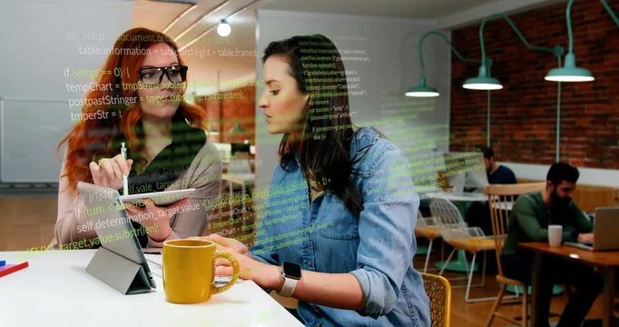 Red-haired woman tapping tablet, brunette typing laptop reviewing code, overlay growing over screen