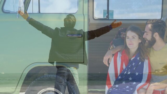 Fade starting standing man arms wide, seated couple sharing flag hug by van merging travel ad