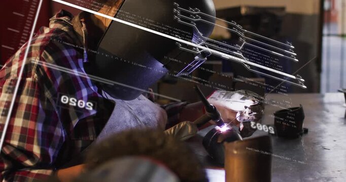 Woman welder producing arc in workshop, activating HUD while adjusting joint and completing weld