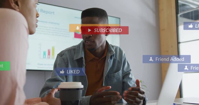 Pair sharing business charts, tapping laptop and causing alerts filling display and refocusing
