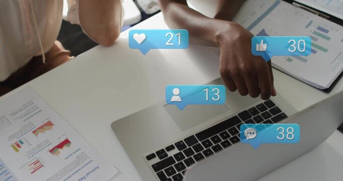 2 women pointing at laptop and charts causing blue bubbles rising while analyzing marketing KPIs