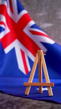 Flag-themed board with NEWS text for media headlines. Patriotic mockup with text NEWS Vibrant Australian flag background trending for current affairs content. Concept of national reporting and media