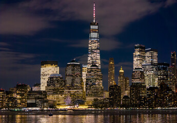 Obraz premium New York night skyline. New York city skyline night. New York Manhattan night panorama. New York glowing towers night.