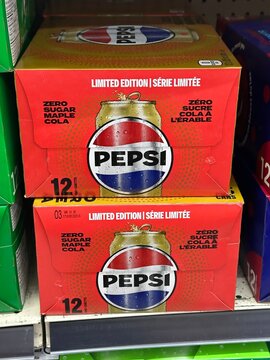 Pepsi Maple Zero Sugar limited edition 12-pack soda cases displayed on grocery store shelf in Alberta, Canada. February 14, 2026. Gleichen, Alberta, Canada. Editorial Use Only.