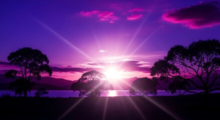 Intense purple sunset illuminates a tranquil waterscape bordered by silhouetted trees and distant hills
