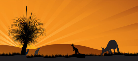 Kangaroo silhouettes graze and sit against a warm orange sunset over rolling outback hills, tall grass and a distinctive grass tree, evoking calm, wilderness and iconic Australian nature scenery. © electra kay-smith