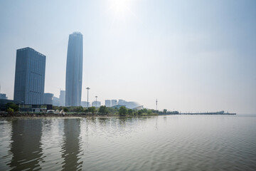 Obraz premium Serene Urban Landscape at the Waterfront with Modern Skyscrapers