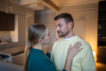 Obraz premium Suspicious wife and lying worried husband, nervous man showing guilt and fear after cheating on beloved woman, long-term toxic relationships caused by lies and mistrust, jealousy and extreme control.