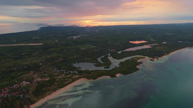 High-angle sunset view of the island of Bantayan, showcasing the peaceful mangrove ecosystem and sea