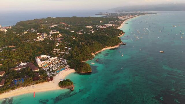 Cinematic drone vista over a pristine tropical bay in the Philippines, capturing the harmony of jungle and ocean