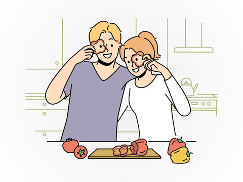 Payful Couple Having Fun in the Kitchen 