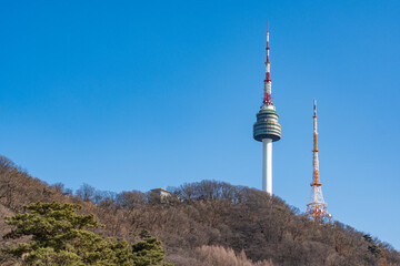 Obraz premium N Seoul Tower with autumn landscape. It is also known as Namsan Tower or Seoul Tower, the landmark which is a communication and observation tower located on Nam Mountain in central Seoul, South Korea