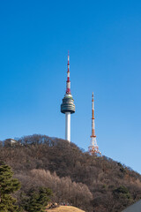 Obraz premium N Seoul Tower with autumn landscape. It is also known as Namsan Tower or Seoul Tower, the landmark which is a communication and observation tower located on Nam Mountain in central Seoul, South Korea