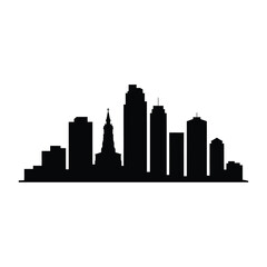 Silhouetted cityscape featuring modern skyscrapers and a prominent church spire