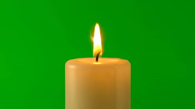 A wide, stubby candle with a vibrant, flickering flame, isolated on green screen illumination, motion, farmhouse