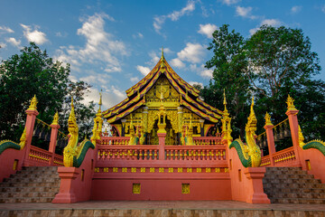 Fototapeta premium Landmark Sunrise with sky at Wat Phra That Doi Phra Chan on the top hill of Doi Phra Chan mountain in Mae Tha, Lampang province, Thailand