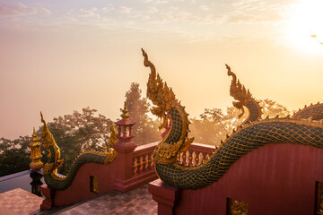Fototapeta premium Landmark Sunrise with sky at Wat Phra That Doi Phra Chan on the top hill of Doi Phra Chan mountain in Mae Tha, Lampang province, Thailand