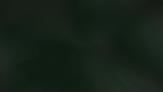 A creeping shadowy light slowly expands and retreats ominously, isolated on green screen dark, isolated, visual