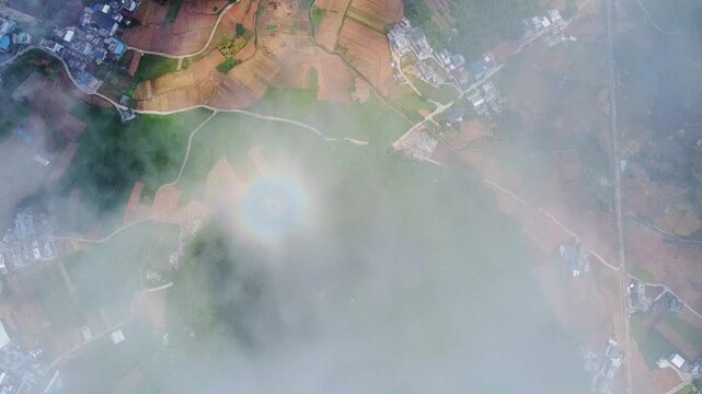 Rainbow Ring in Misty Sky Over Guangxi Countryside, Natural Optical Wonder