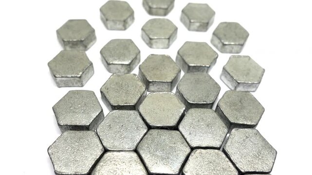 Descending view of pattern of metal hexagons (zinc).