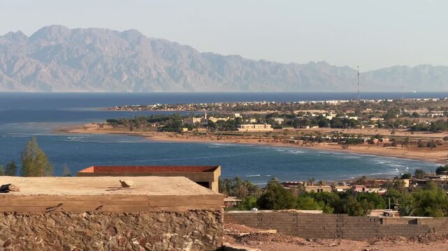 Panoramic fast motion car view of coastal City of Nuweiba With Desert Mountains and The Gulf of Aqaba Shoreline