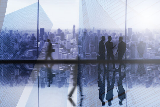 Double exposure image Business agreement concept showing blurred conference group meeting on city office building in background showing partnership success of business deal. Concept of teamwork