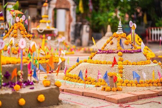 Thai people come to build the Sand Pagoda for return the sand to the temple on Songkran festival at Ratchaburana temple in Phitsanulok Thailand.