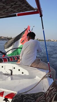 Traveler Sailing Traditional Felucca on the Nile in Luxor