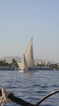 Traditional felucca sailing on the Nile River in Egypt