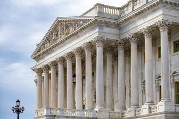 Obraz premium Columns marble Tall vertical structure. Columns fluted architectural symmetry. Columns decorative capitals ornament Sculpture. Columns classical heritage exterior.