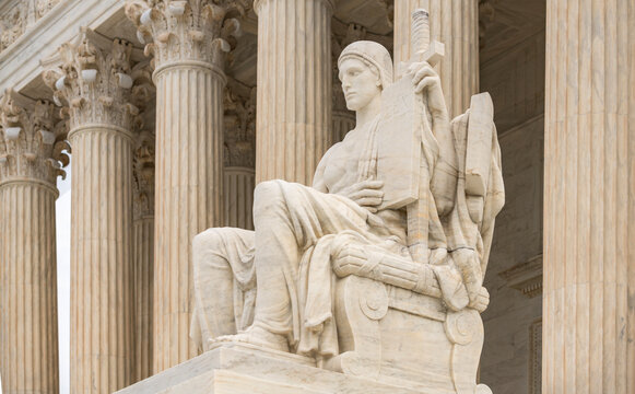 Authority of Law supreme court sculpture. Classical architecture heritage exterior. Law lex constitution judicial governance. Historic landmark justice.