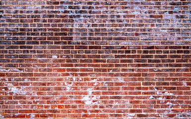 Naklejka premium Wall on exterior facade. Bricks in masonry block. Background on surface texture. Wall for rustic backdrop.