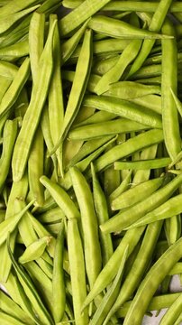 Top View of Fresh Gawar Ki Phalli (Cluster Beans) &ndash; Green Vegetable Vertical Footage