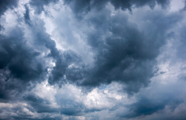 Fototapeta premium Dark sky with stormy clouds. Dramatic sky rain,Dark clouds before a thunder-storm,clouds before rain