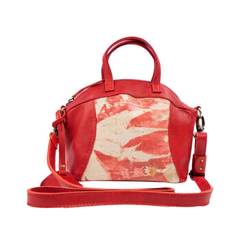 Beautiful oramge leather bag for women with floral ecoprint motif isolated on white background. Perfect for leather product catalog design.