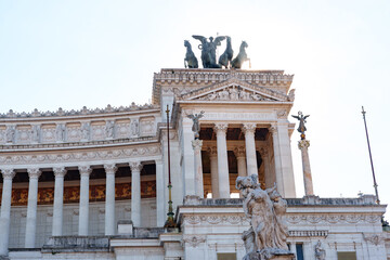 Naklejka premium View of a historic building with sculptures in Rome during the day
