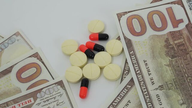 Medicine and money to illustrate medical treatment costs. Money to pay for medical treatment at a hospital or clinic.