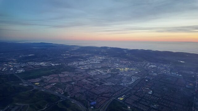 Beautiful flightpath over Irvine, Orange County, California. Spectacular aerial views of Irvine Great Park, master planned communities, and Southern California's iconic coastline.