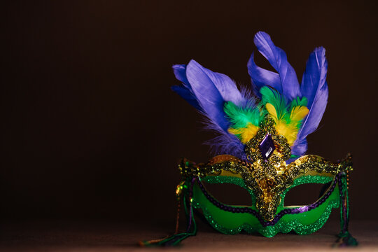 Photo of elegant and delicate Venetian mask over dark background - banner