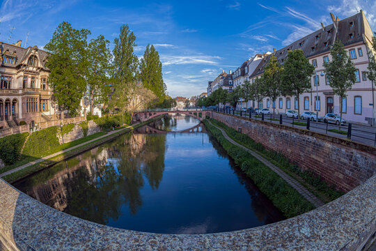 STRASBOURG, ALSACE, FRANCE: View from the Pont de la Poste (Post Office Bridge) along the Canal du Faux-Rempart and the Quai Lezay-Marnesia. Faux Rempart footbridge in background.
